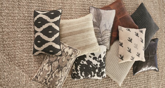 Assorted black, gray and brown pillows.
