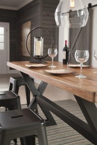 angled view of Glosco two tone wood table and metal backless stools