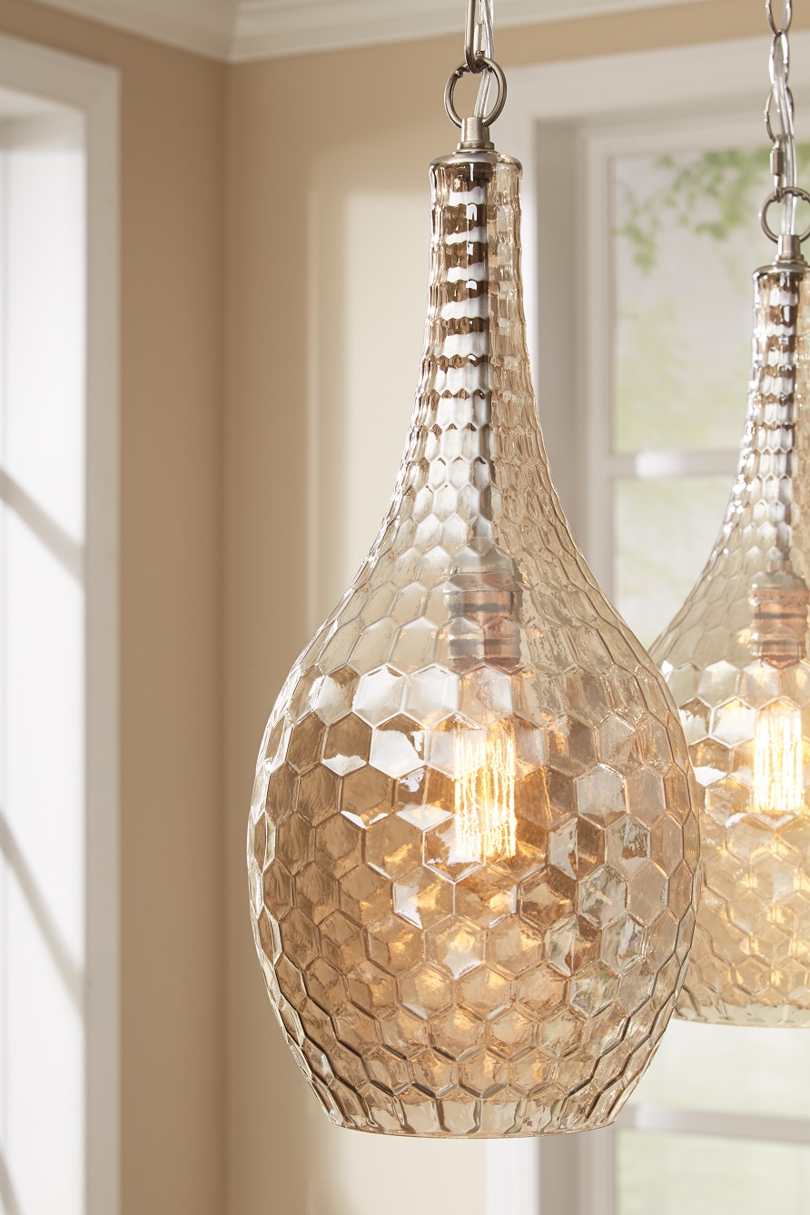 Elegant and bright chandelier pendant light hanging form the ceiling. 