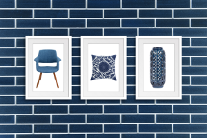 Navy blue tile with picture frames hung up with navy blue ashley product.