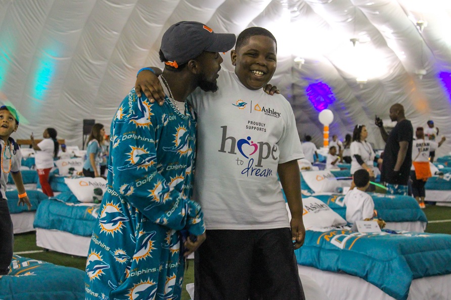 Touchdown! City Furniture, Miami Dolphins bring better sleep to kids in  need - Furniture Today