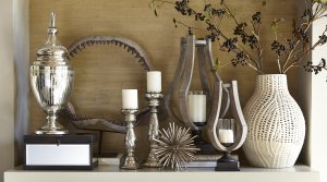 Various candle holders table decorations and vases sold by Ashley Furniture.