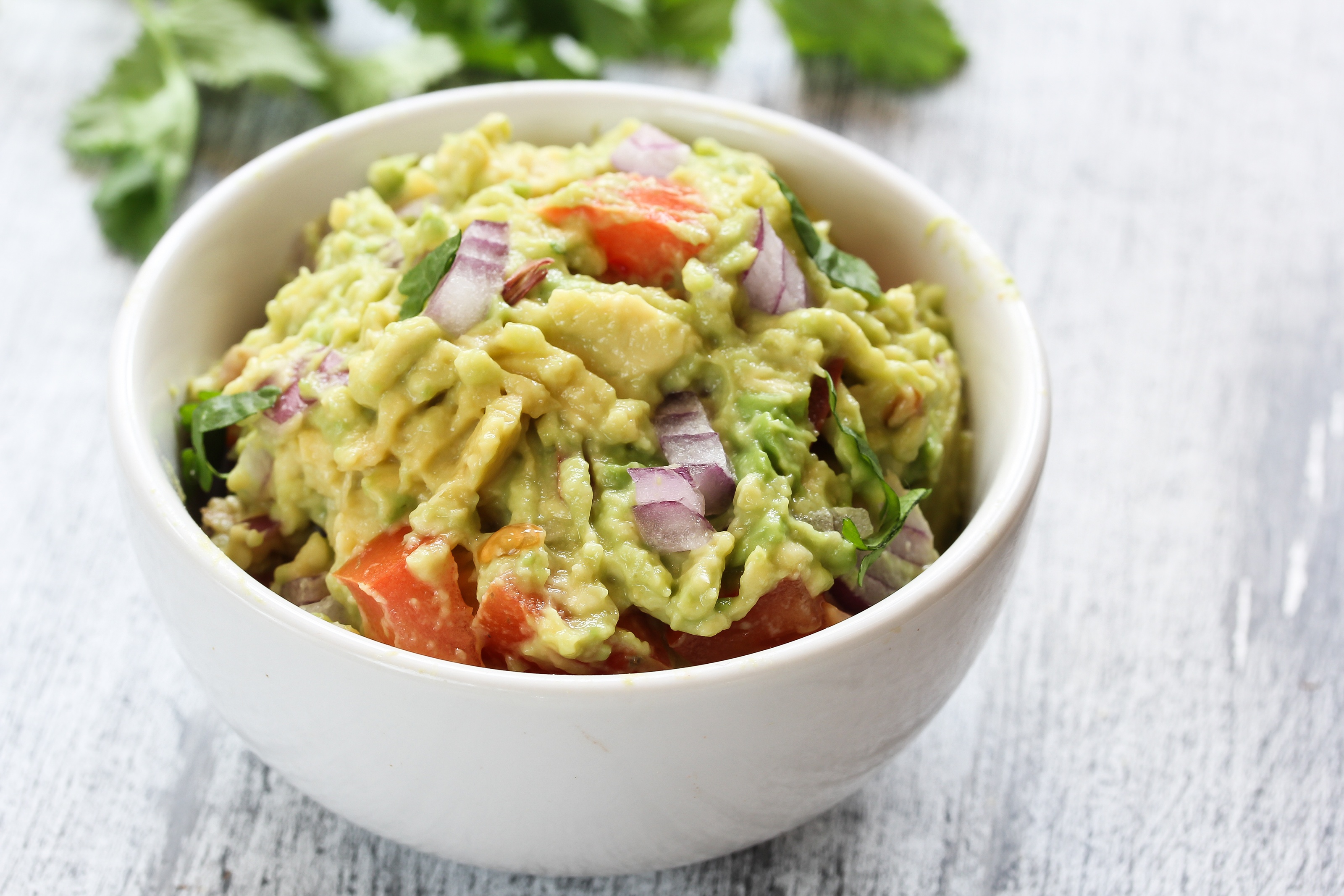 Guacamole with onions, tomatoes, egg and quinoa