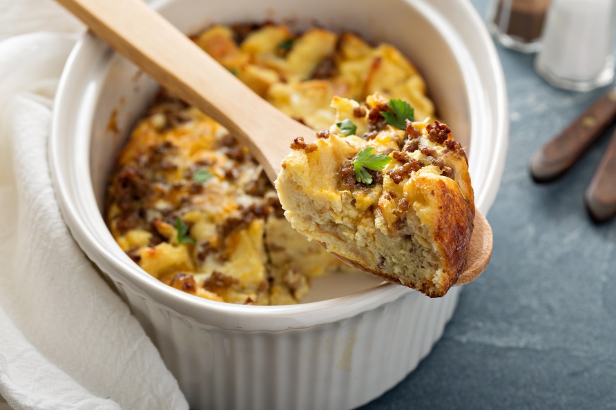 Breakfast strata with cheese and sausage in baking dish