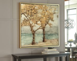 trees in a seascape large wall art on a wall above a console table.