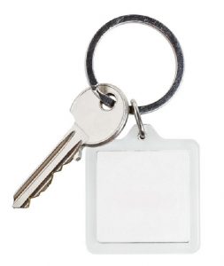 one cylinder lock key and square keychain on ring isolated on white background