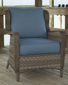 Blue woven wicker cushioned lounge chair.