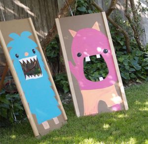 diy bean bag toss game made to look like little monsters
