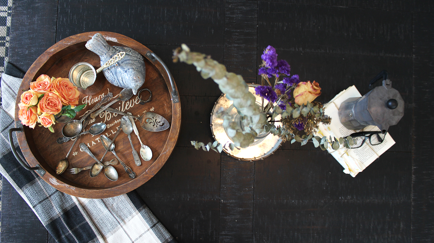 Overhead shot of a small coffee table with farmhouse style decor.