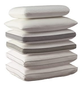 a pile of pillows stacked up.