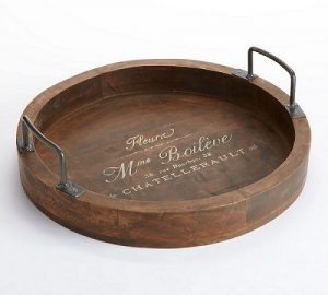 A knock out image of a white wooden rustic tray with handles.