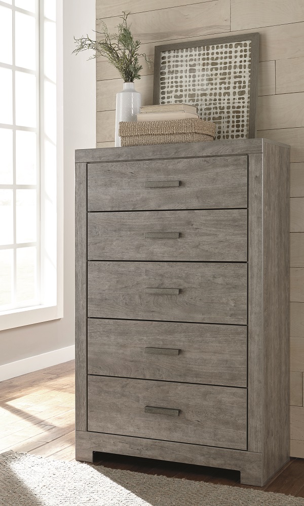 Gray wooden textured drawer chest with beachy decor on top
