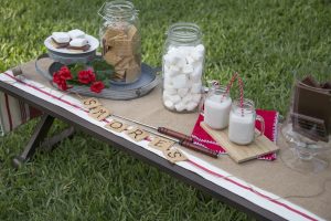 Smores bar outside during a 4th of july barbecue.