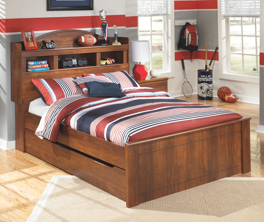 Brown twin bed for little boys room with extra drawers for storage.