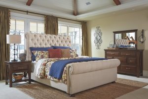 Neutral colored queen sleigh bed