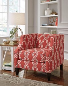 Red and patterned accent chair with a coast decor theme.