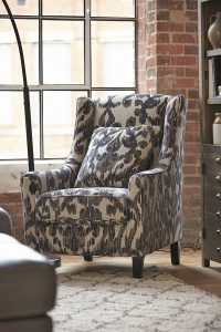 sloped arm accent chair with ikat design in shades of gray