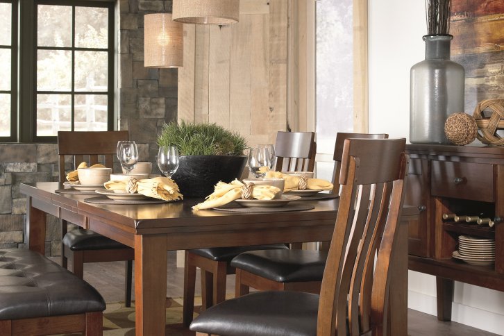 Strumfeld warm brown dining table with upholstered seating and serving table