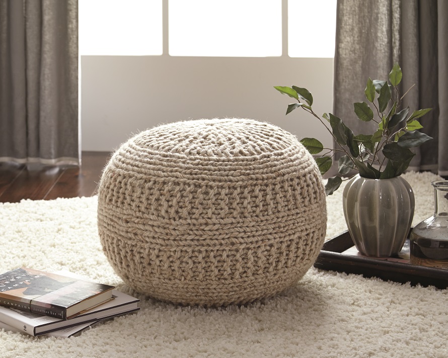 round cable knit wool pouf in natural colored fabric