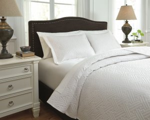 white coverlet set with basketweave stitching pattern