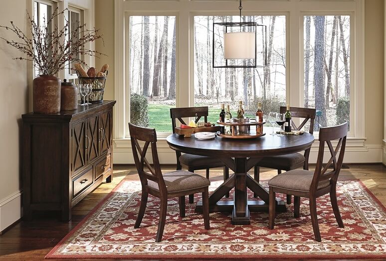 warm dining room table set with three cabinet buffet
