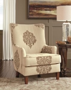 Traditional High Back Accent Chair with cream color and dark brown designs on it.