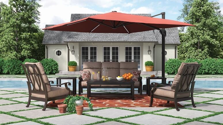 Large red umbrella hovered over an outdoor furniture set.