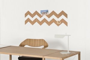Cardboard sticker above a desk used as trendy wall decor.