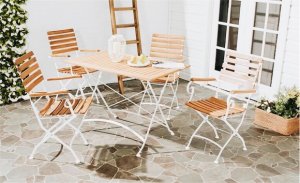 wooden table with four chairs outside