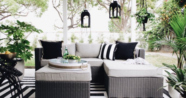 gray patio set with black pillows