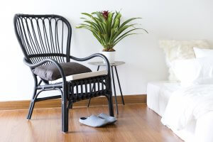 black rattan chair in bedroom