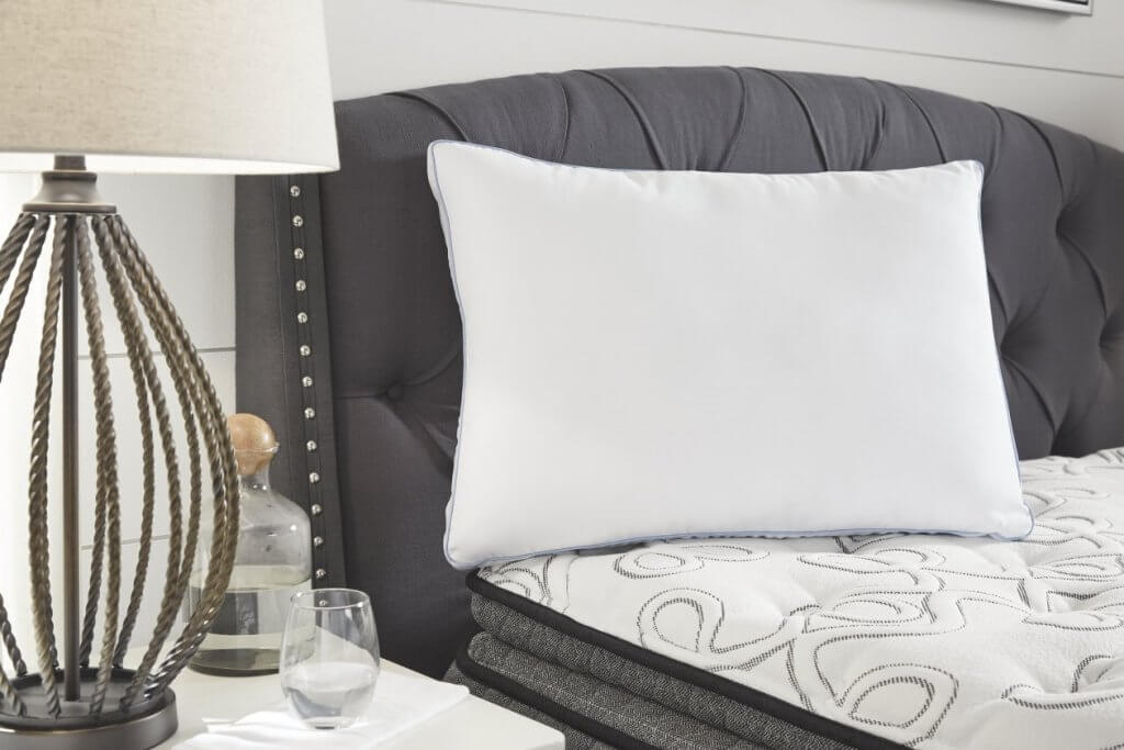 white pillow on bed