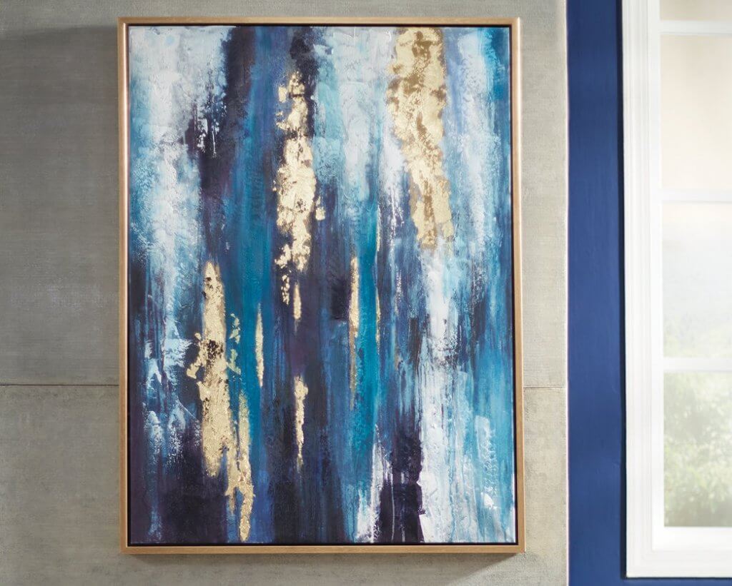 blue and gold painting hanging on wall