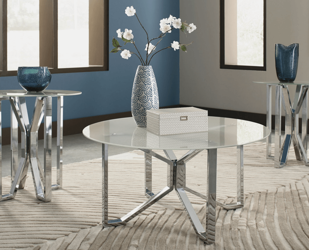 blue vase with white flowers on glass coffee table