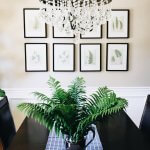 table with plant and chandelier overhead