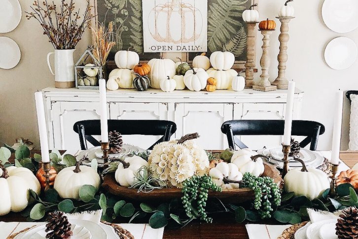 dining room table decorated for fall with pumpkins