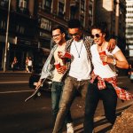 friends walking down sidewalk