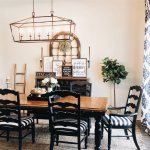 brown dining table with black chairs