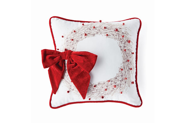red and white pillow with box on it