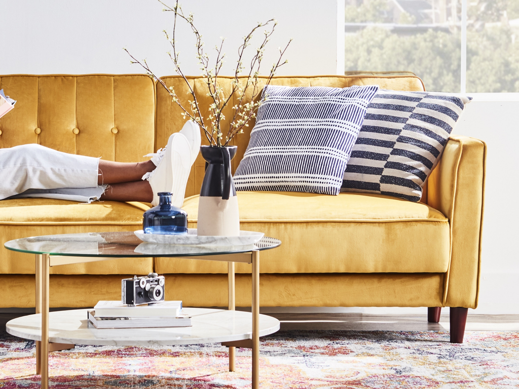 Yellow sofa with blue and white home decor accents